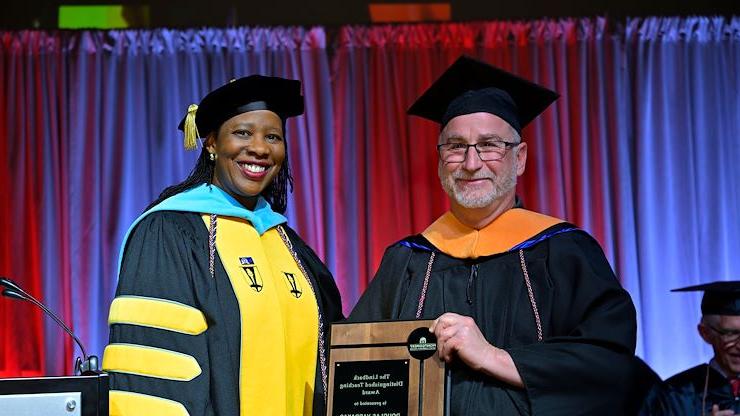 Physics Instructor Douglas Vardakas stands with Dr. Chae Sweet, Vice President of Academic Affairs and Provost at Commencement. Vardakas was named the 2024 recipient of the Lindback Distinguished Teaching Award. Photo by Dave DeBalko